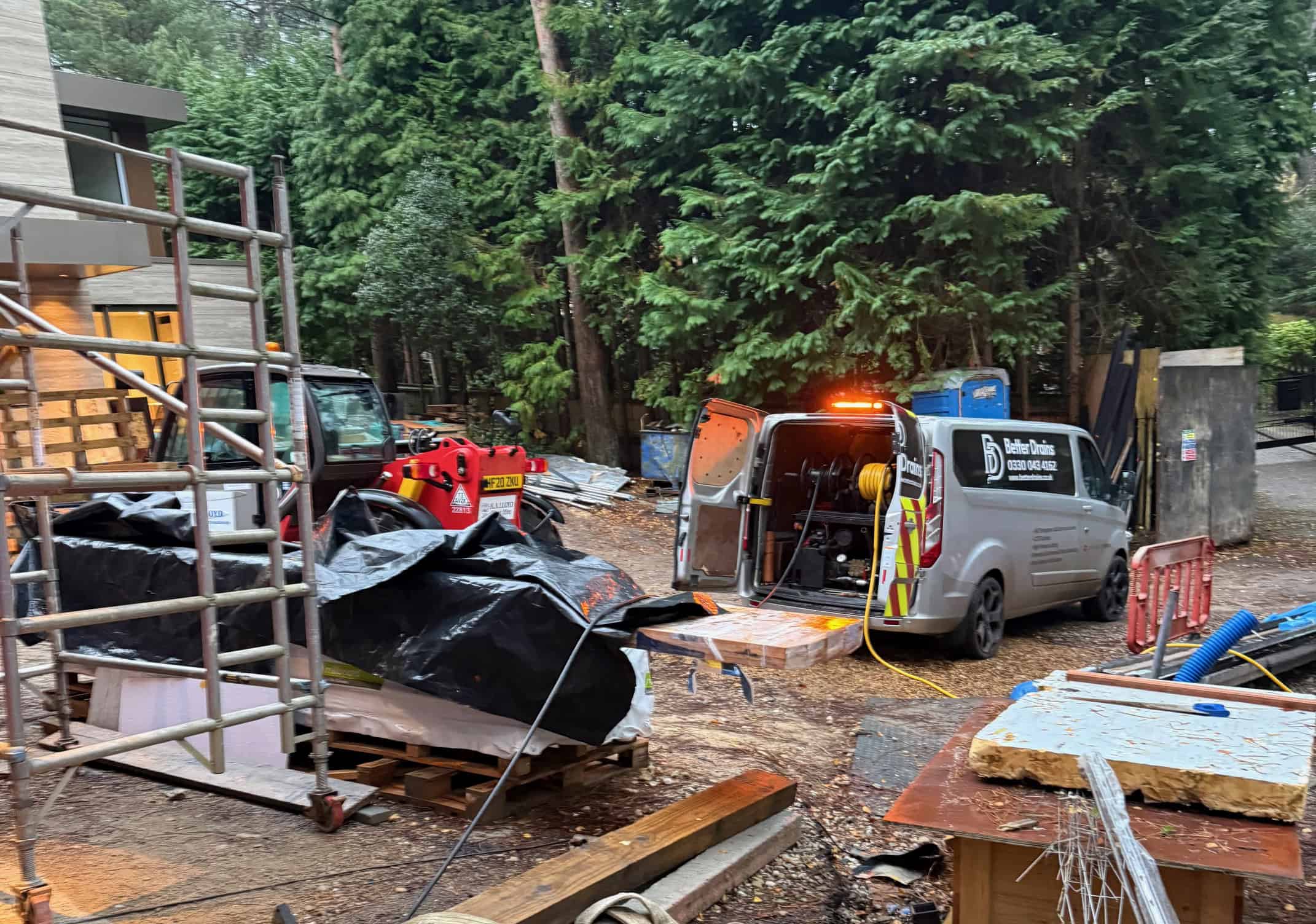 Professional soakaway system setup in a wooded area.